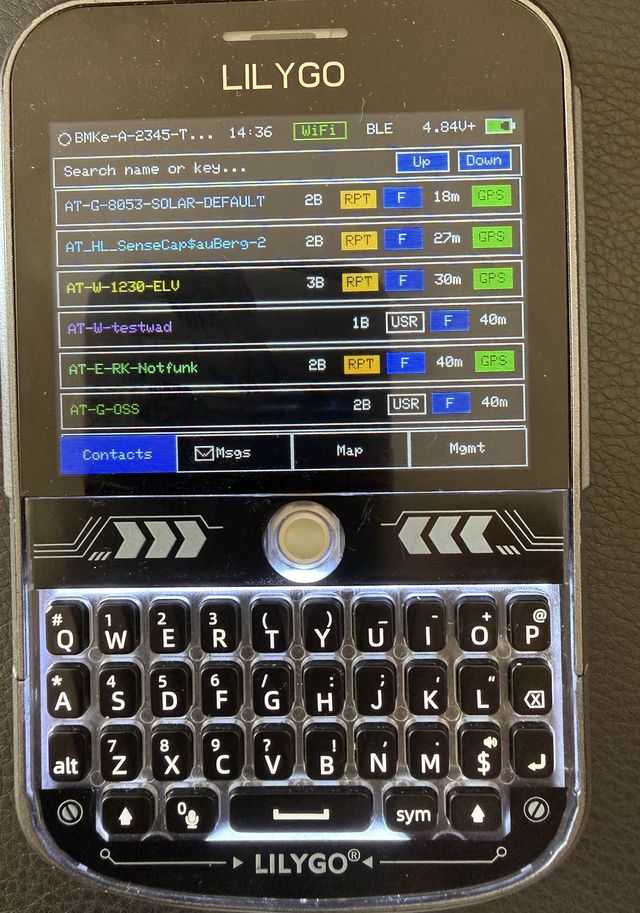 LilyGO T-Deck Plus running MCTerm: contact list with repeaters, badges and hop counts